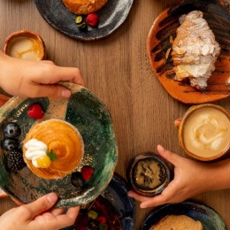 people reaching for food