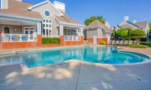 a swimming pool in front of a building