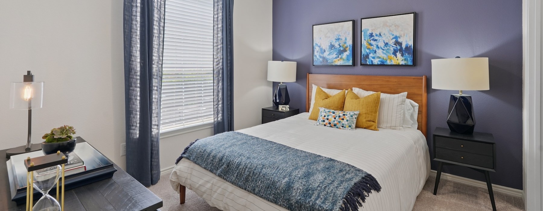 a bedroom with a fan and a bed